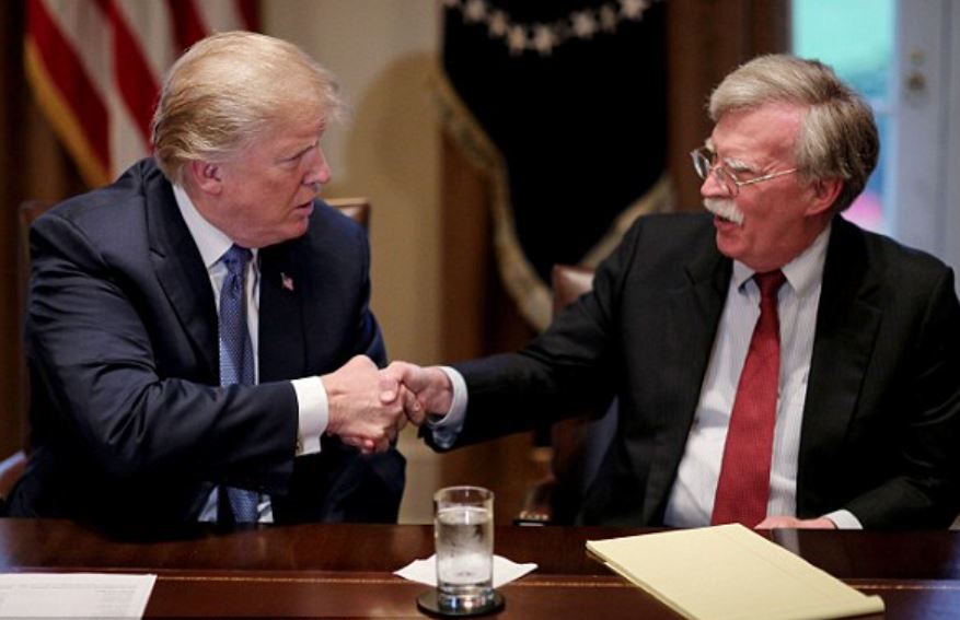 Bolton Raided, Leak Probe Widens